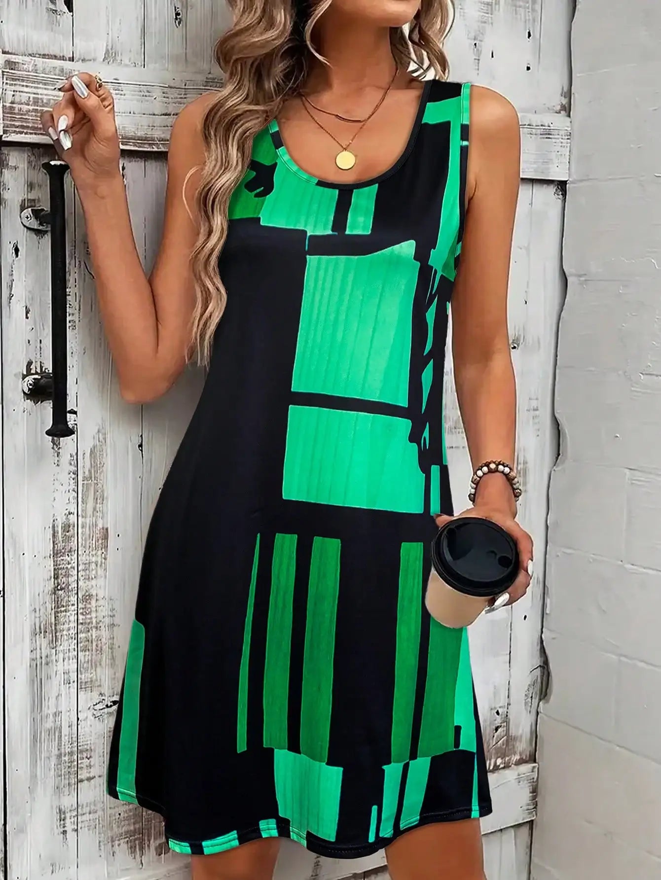 Faustine – Robe midi bohème à motif géométrique sans manches