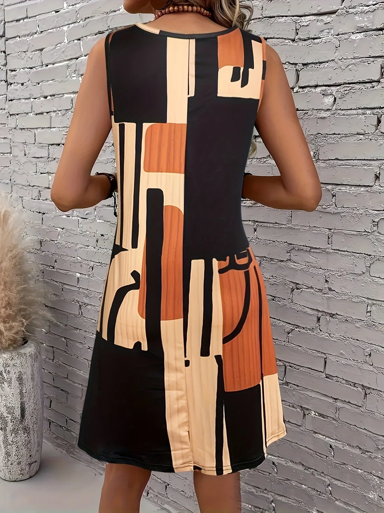Faustine – Robe midi bohème à motif géométrique sans manches