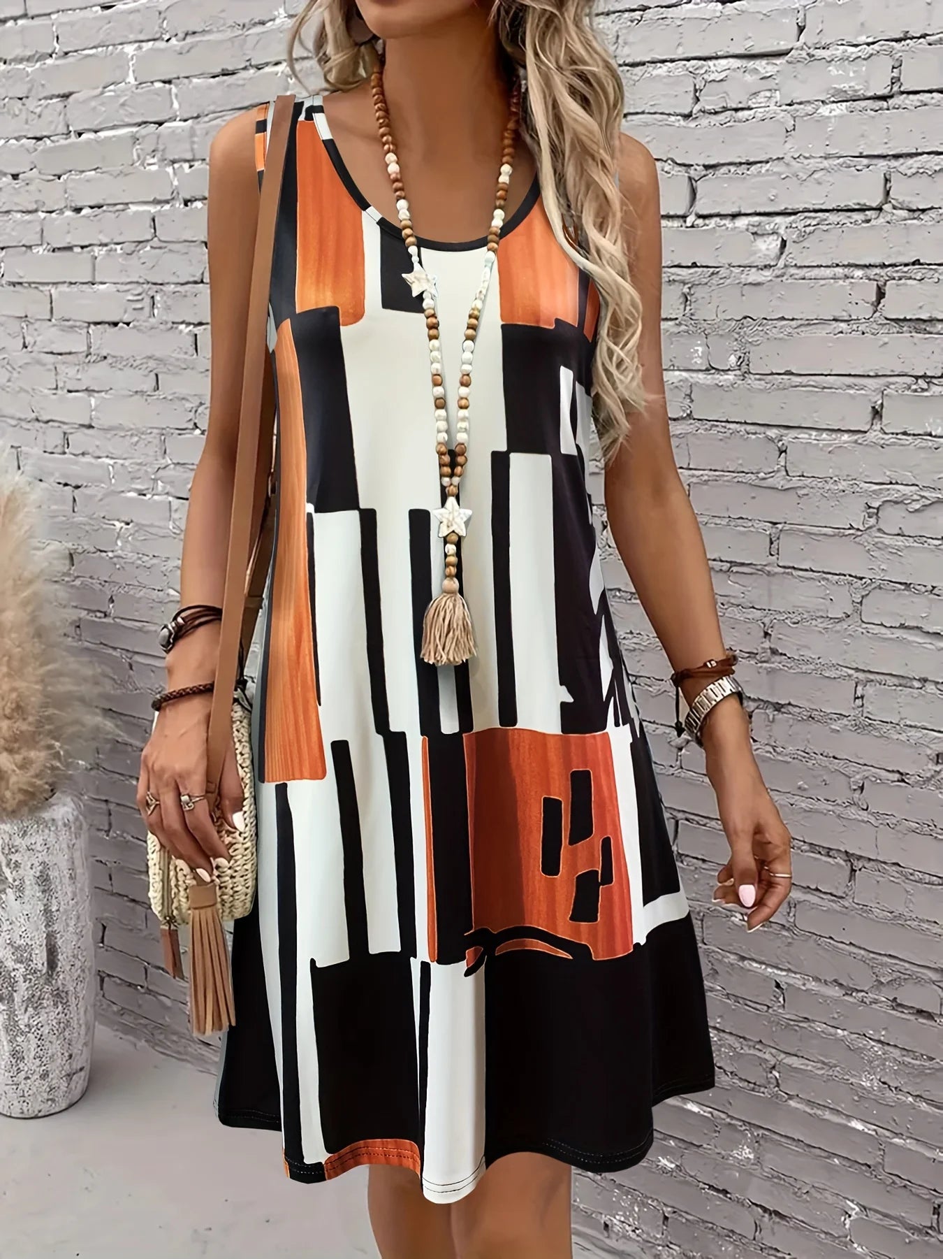 Faustine – Robe midi bohème à motif géométrique sans manches