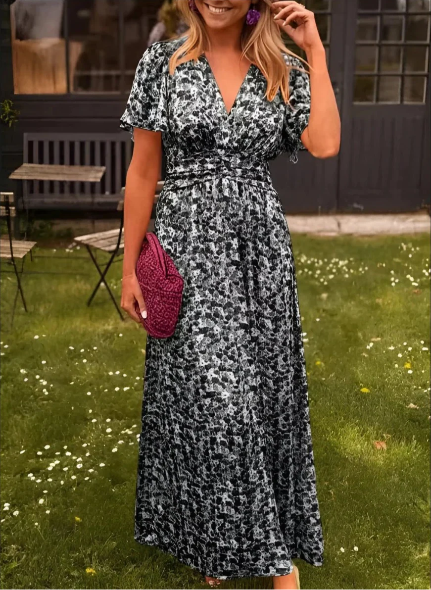 Robe longue fleurie à taille marquée et coupe fluide pour l'été