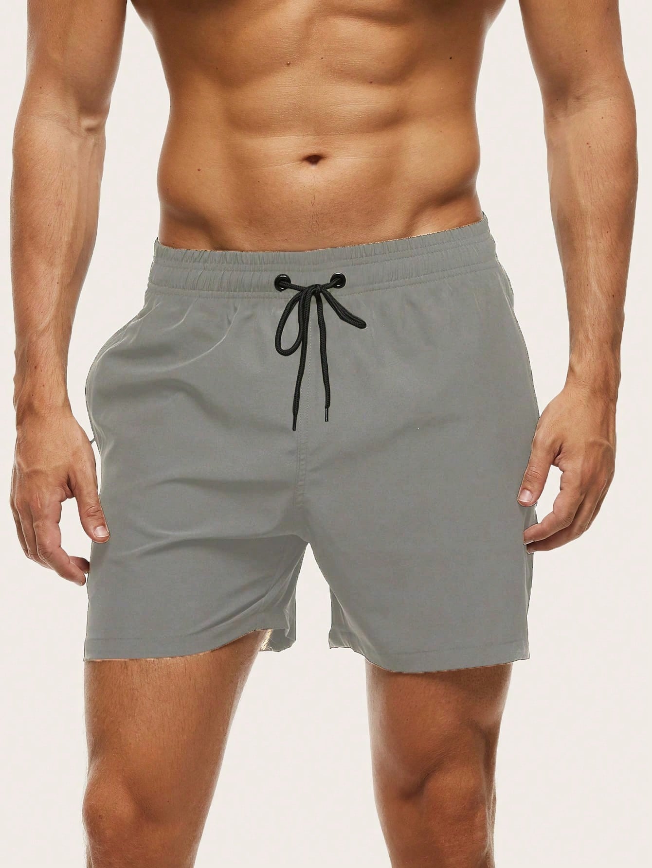 Short de bain homme séchage rapide doublé à poche zippée